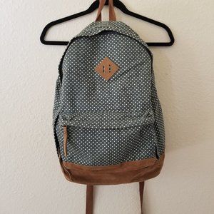 green and white polka dot backpack